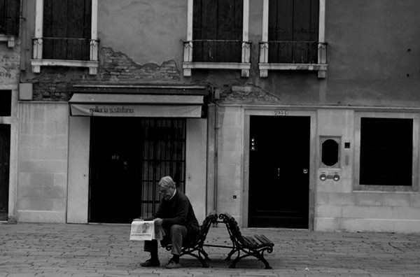 Quiet Times #7 by Jeremy Chin - Reading Newspaper on the Bench, Venice, Italy
